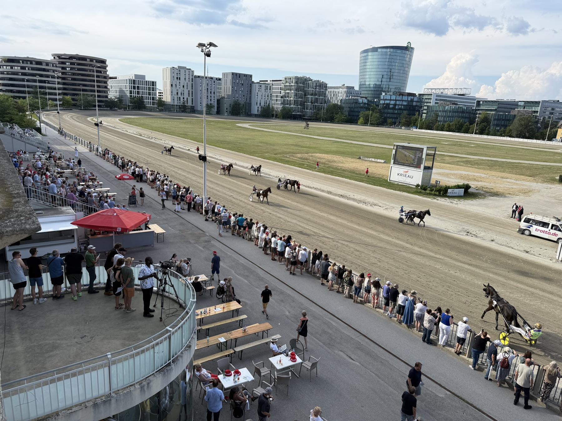 Krieau Derby live race with horses, crowd, and grandstand